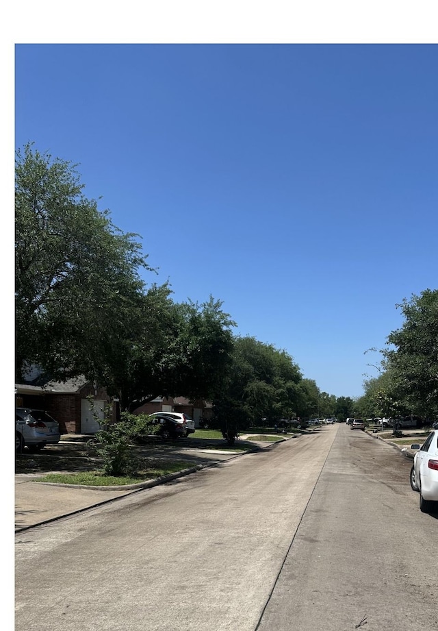 view of street with curbs