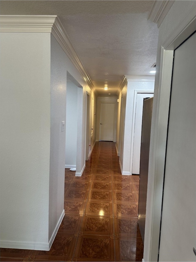 corridor with crown molding and baseboards