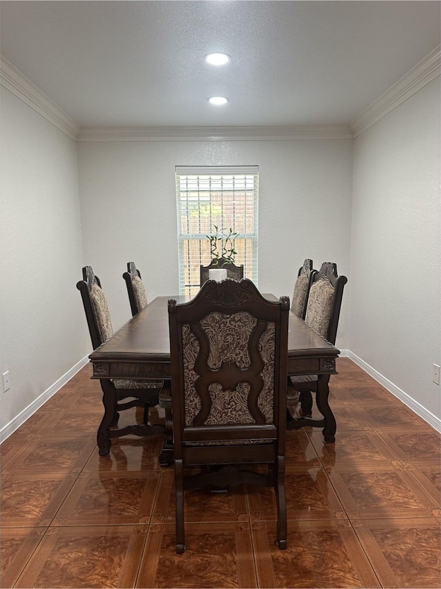 dining space featuring crown molding, recessed lighting, baseboards, and wood finished floors