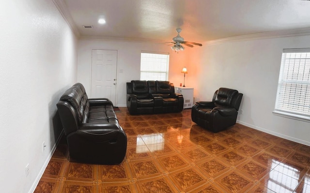 living area with crown molding, ceiling fan, visible vents, and baseboards