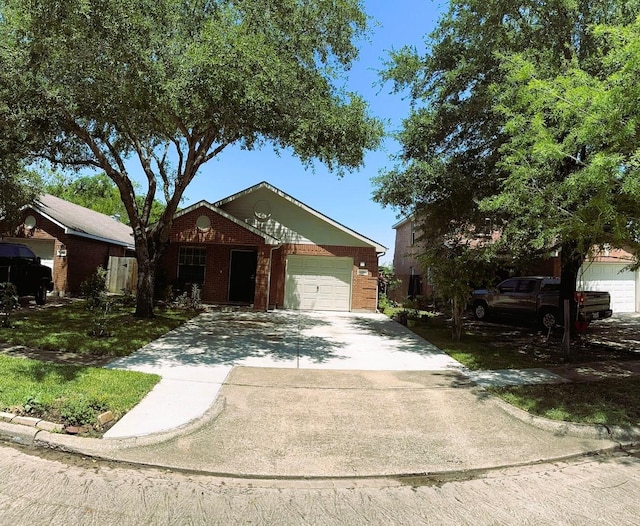 view of front facade featuring concrete driveway, brick siding, and an attached garage