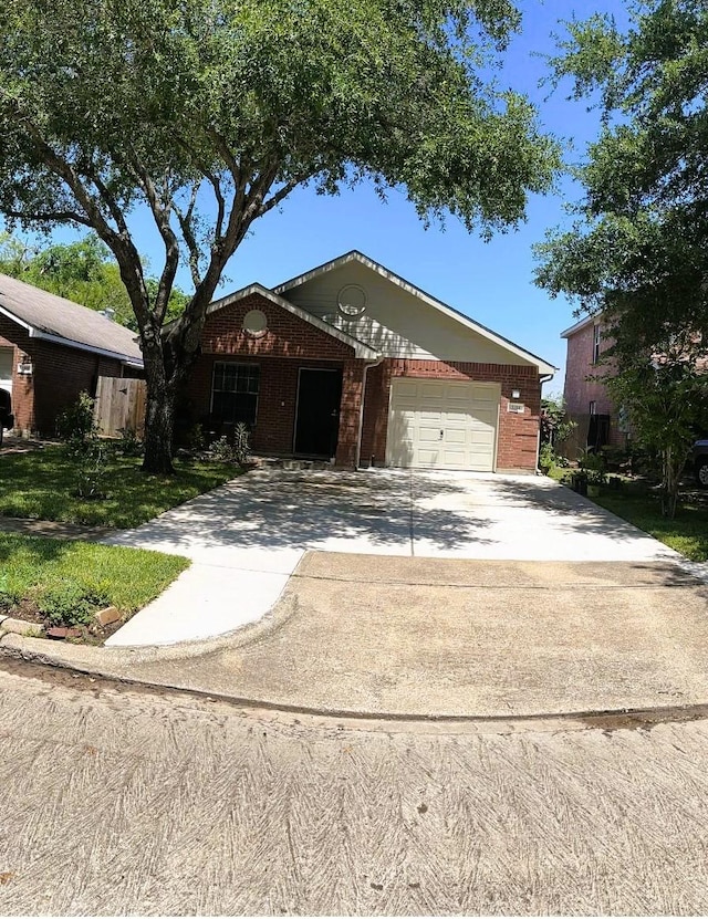 ranch-style home featuring brick siding, an attached garage, and concrete driveway