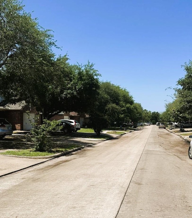 view of road featuring curbs