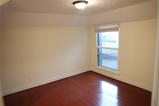 1035 Wirt Rd, Houston, TX 77055 - spare room with dark wood-type flooring, a textured ceiling, and baseboards