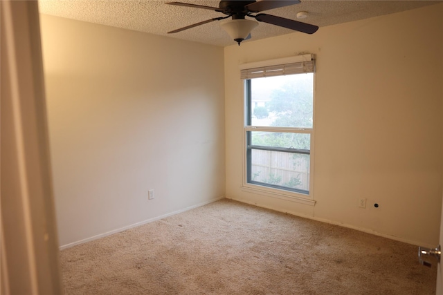 1035 Wirt Rd, Houston, TX 77055 - spare room featuring baseboards, carpet, a ceiling fan, and a textured ceiling