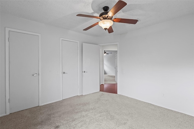 1035 Wirt Rd, Houston, TX 77055 - unfurnished bedroom with carpet flooring, a textured ceiling, and ceiling fan