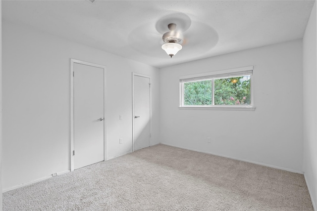 1035 Wirt Rd, Houston, TX 77055 - unfurnished bedroom featuring carpet floors and a ceiling fan