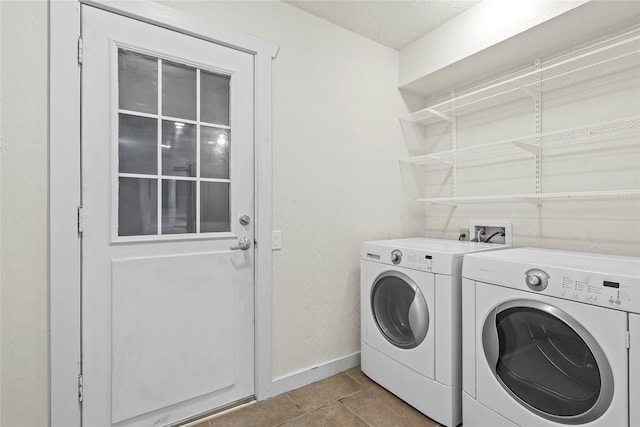 1035 Wirt Rd, Houston, TX 77055 - laundry room with washing machine and clothes dryer and baseboards