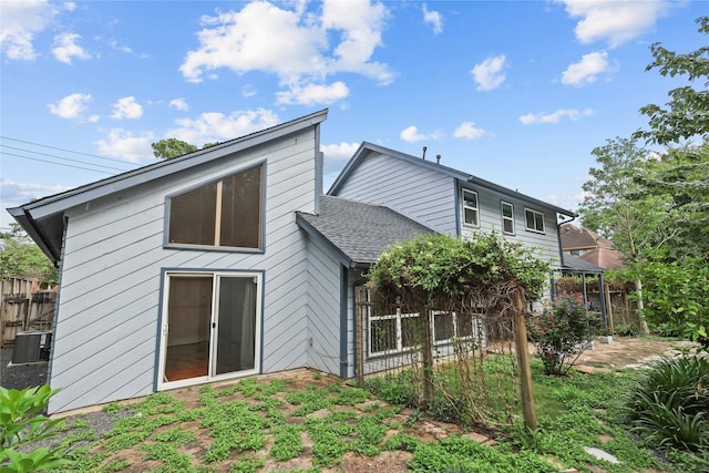 1035 Wirt Rd, Houston, TX 77055 - rear view of house with roof with shingles