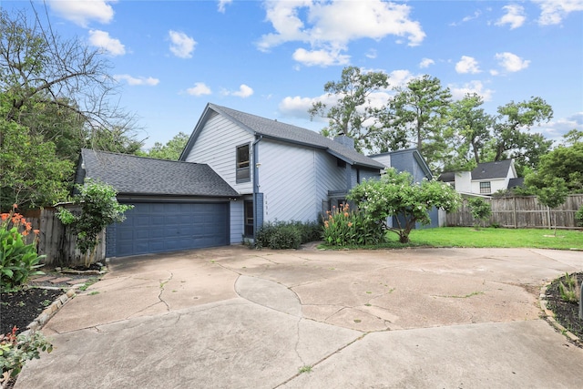 1035 Wirt Rd, Houston, TX 77055 - view of side of home with concrete driveway, a garage, and a shingled roof