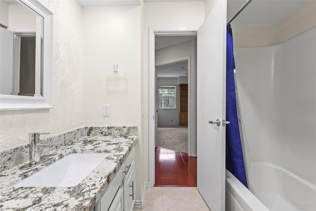 1035 Wirt Rd, Houston, TX 77055 - full bath with vanity, shower / bath combo with shower curtain, and tile patterned floors