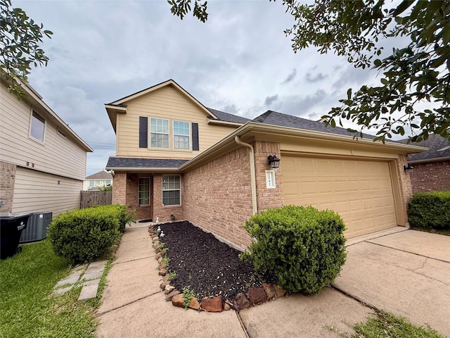 view of front facade with a garage, central AC, fence, brick siding, and driveway