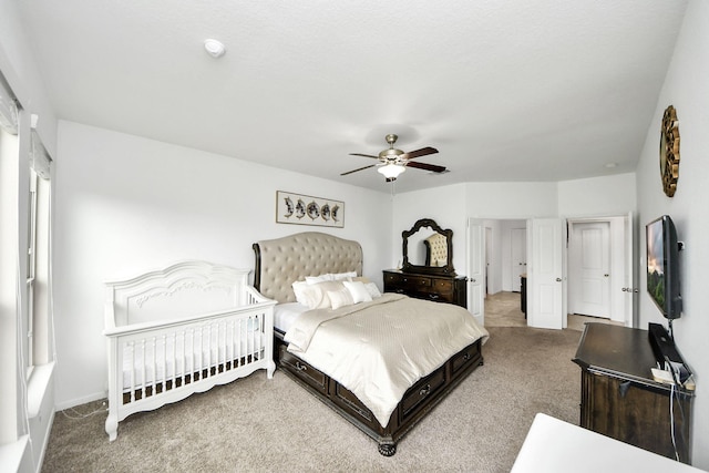bedroom with baseboards, a ceiling fan, and carpet