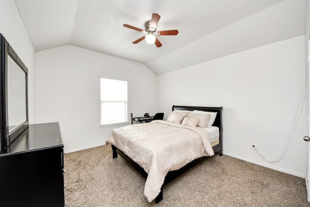 bedroom featuring a ceiling fan, baseboards, light carpet, and lofted ceiling