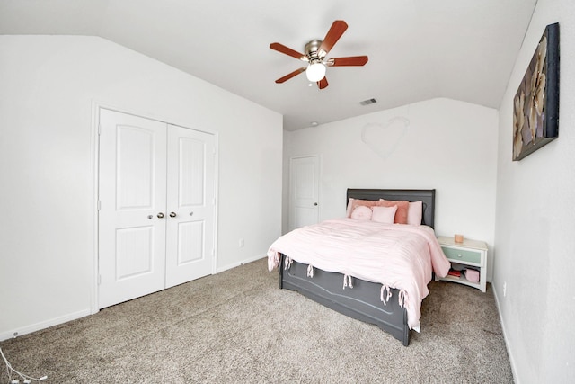 carpeted bedroom with a closet, a ceiling fan, lofted ceiling, and visible vents