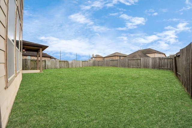view of yard featuring a fenced backyard