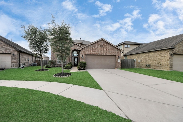 view of front facade featuring a garage, a front lawn, fence, brick siding, and concrete driveway