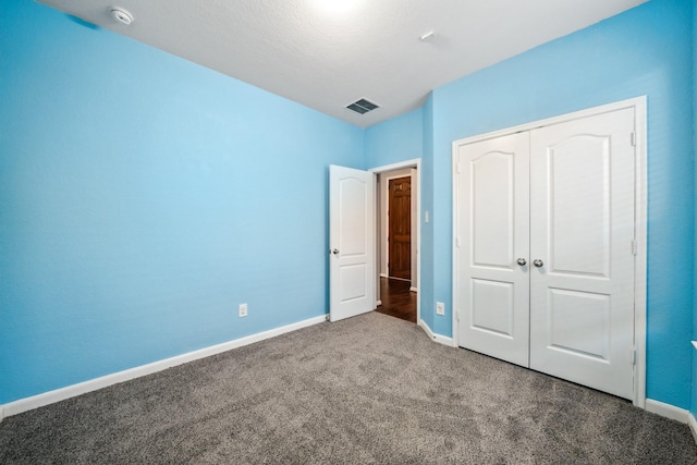 22507 Bellwick Ridge Ln, Katy, TX 77449 - unfurnished bedroom featuring baseboards, carpet, a closet, and visible vents