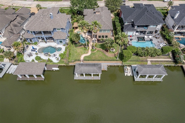 bird's eye view with a water view and a residential view