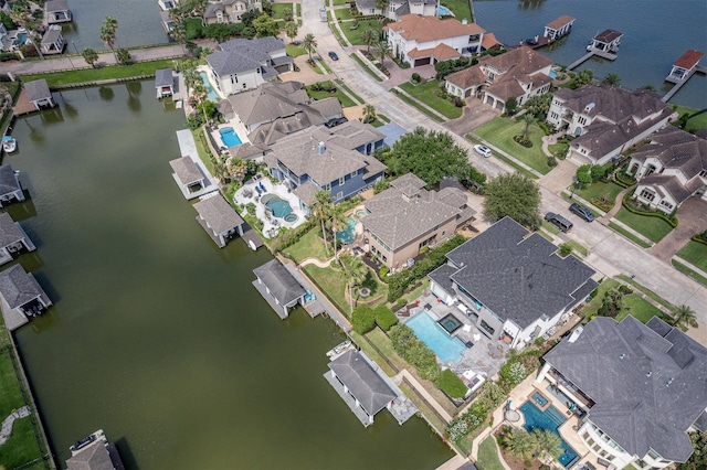 aerial view featuring a residential view and a water view