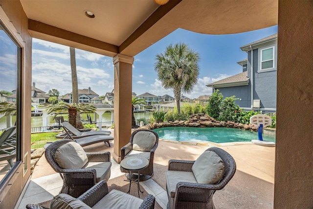 view of patio / terrace featuring a residential view and an outdoor pool