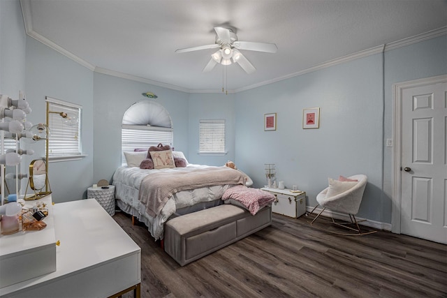 bedroom featuring ornamental molding, a ceiling fan, and dark wood-style floors