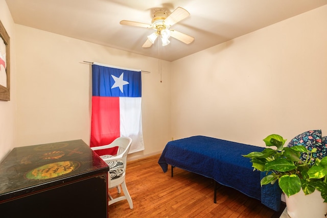 123 S Yaupon St, Lake Jackson, TX 77566 - bedroom with a ceiling fan and wood finished floors