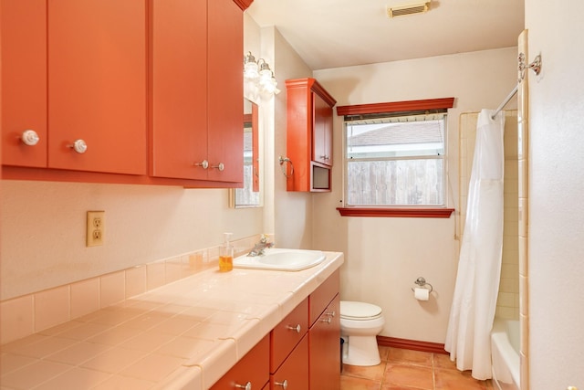 123 S Yaupon St, Lake Jackson, TX 77566 - bathroom featuring visible vents, tile patterned flooring, vanity, toilet, and shower / tub combo
