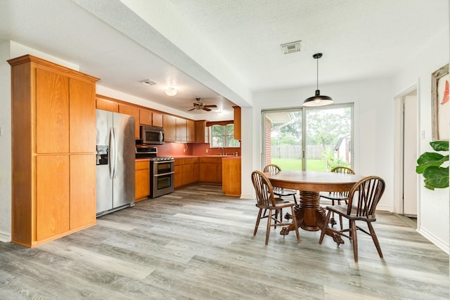123 S Yaupon St, Lake Jackson, TX 77566 - dining area with ceiling fan, visible vents, and light wood-style flooring