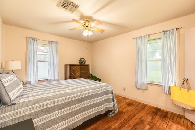 123 S Yaupon St, Lake Jackson, TX 77566 - bedroom featuring a ceiling fan, baseboards, visible vents, and hardwood / wood-style flooring