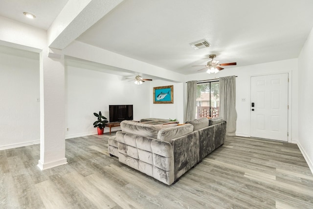 123 S Yaupon St, Lake Jackson, TX 77566 - living area featuring baseboards, a ceiling fan, light wood-type flooring, and visible vents
