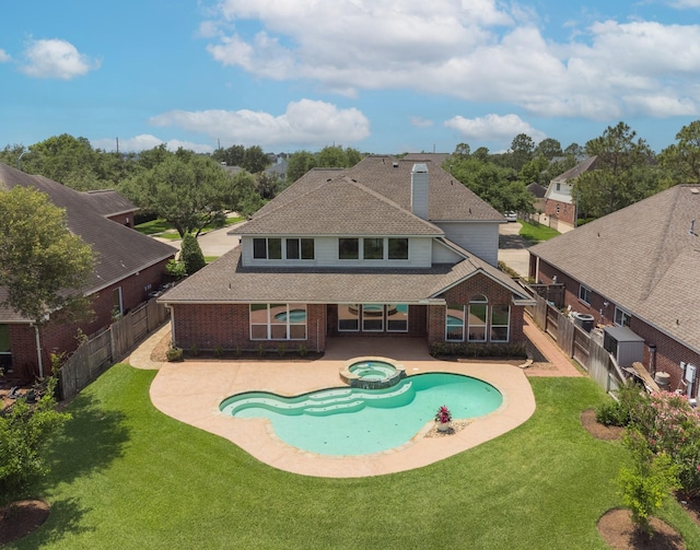 view of pool with a patio, a fenced backyard, and a yard