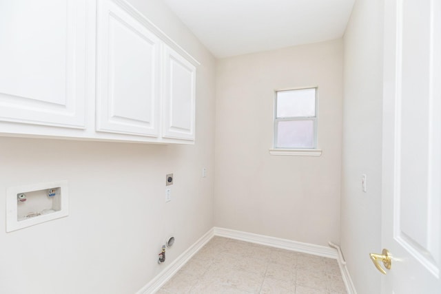 washroom with cabinet space, light tile patterned flooring, hookup for a washing machine, electric dryer hookup, and baseboards