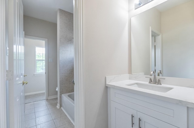 bathroom featuring vanity, shower / bath combination, baseboards, and tile patterned floors