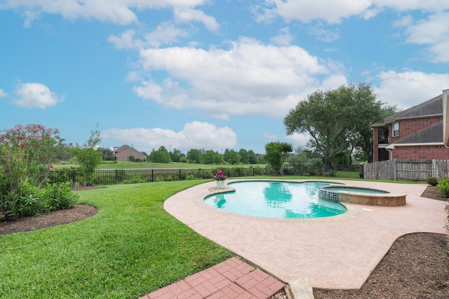 view of swimming pool with a patio, a fenced backyard, a pool with connected hot tub, and a yard