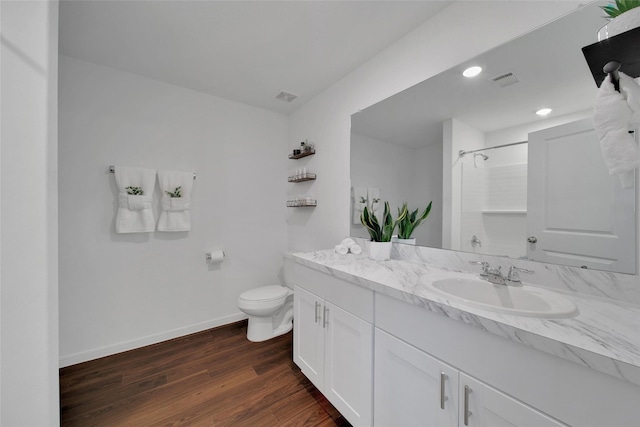 16322 Fontana Ct, Conroe, TX 77302 - full bathroom featuring vanity, a shower, toilet, wood finished floors, and baseboards