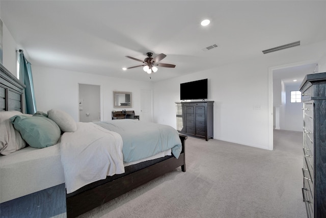 bedroom with light colored carpet, visible vents, a ceiling fan, and recessed lighting