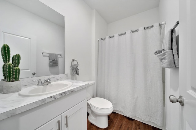 full bathroom featuring vanity, toilet, a shower with curtain, and wood finished floors