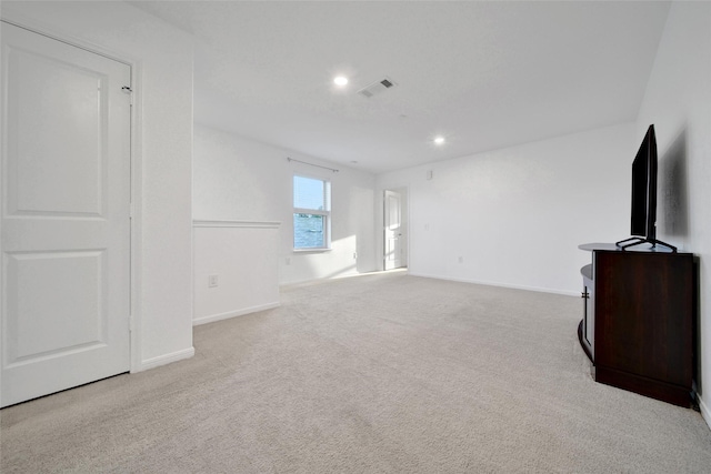 unfurnished living room with baseboards, carpet flooring, and recessed lighting