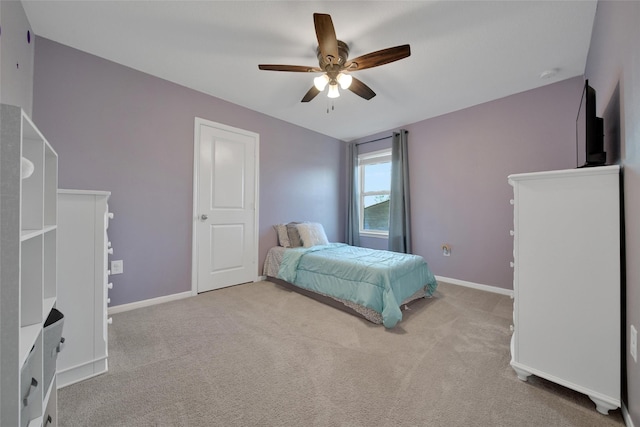 bedroom with baseboards, a ceiling fan, and carpet floors