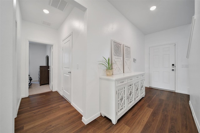 hall featuring baseboards, recessed lighting, visible vents, and dark wood-style floors