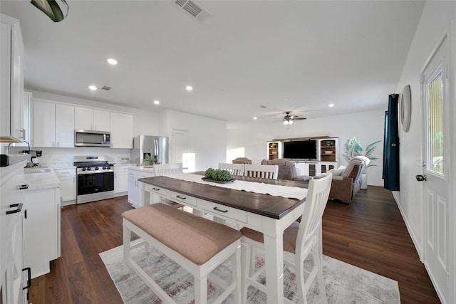 16322 Fontana Ct, Conroe, TX 77302 - dining room featuring ceiling fan, dark wood-style floors, and recessed lighting
