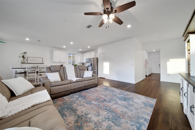 living room featuring ceiling fan, recessed lighting, visible vents, and dark wood finished floors
