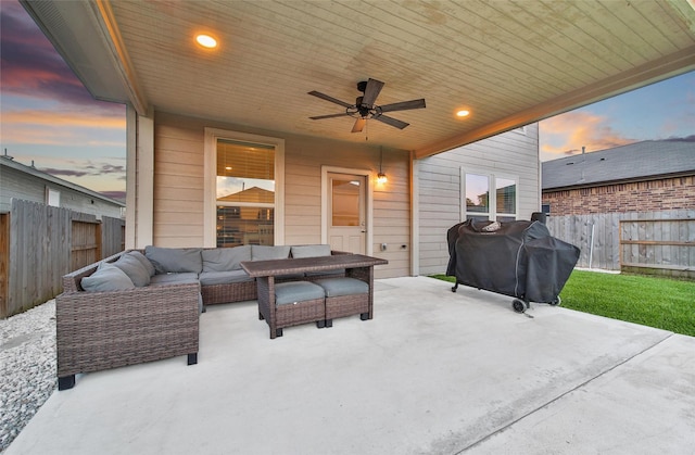 16322 Fontana Ct, Conroe, TX 77302 - fenced backyard featuring ceiling fan, a patio area, outdoor lounge area, and a grill