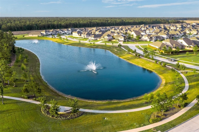 drone / aerial view with a water view and a residential view
