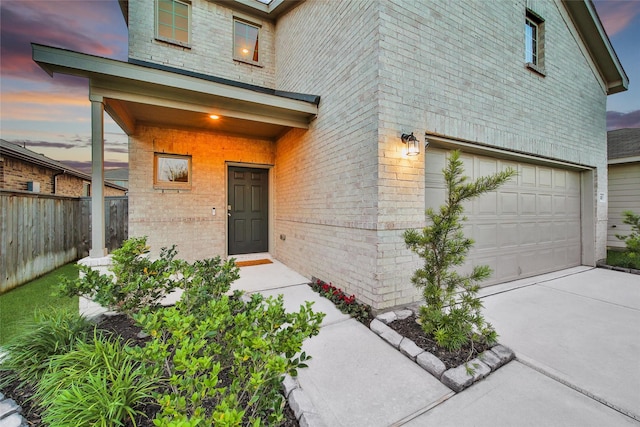 16322 Fontana Ct, Conroe, TX 77302 - entrance to property with brick siding, a garage, and driveway