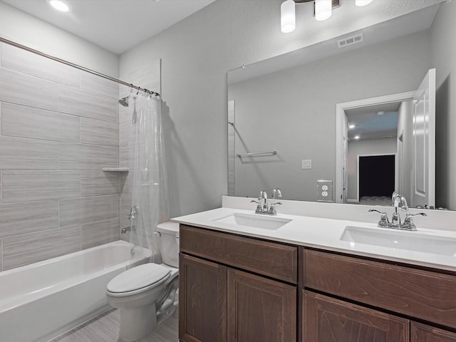16926 Grayson Woods Ln, Humble, TX 77346 - bathroom with a sink, shower / bath combo, toilet, and visible vents
