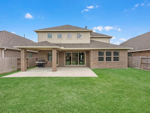 16926 Grayson Woods Ln, Humble, TX 77346 - rear view of property with a fenced backyard, a patio, and brick siding