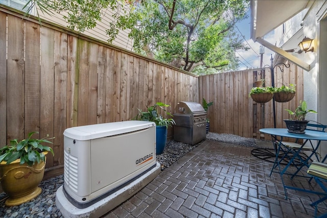 exterior space featuring a fenced backyard and grilling area