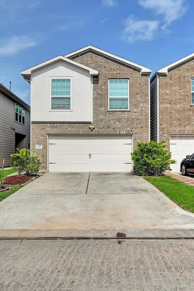 11417 Hackmatack Way, Houston, TX 77066 - traditional home with brick siding, a garage, and driveway